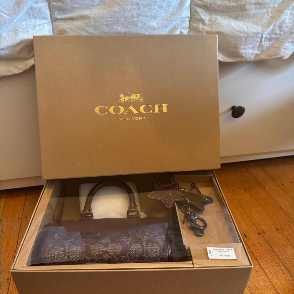 Coach Brown Signature Handbag with Star Keychain